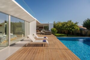 Modern villa with pool and deck with interior and exterior views
