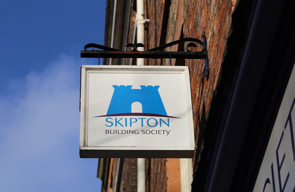 a sign displaying the Skipton Building Society branding